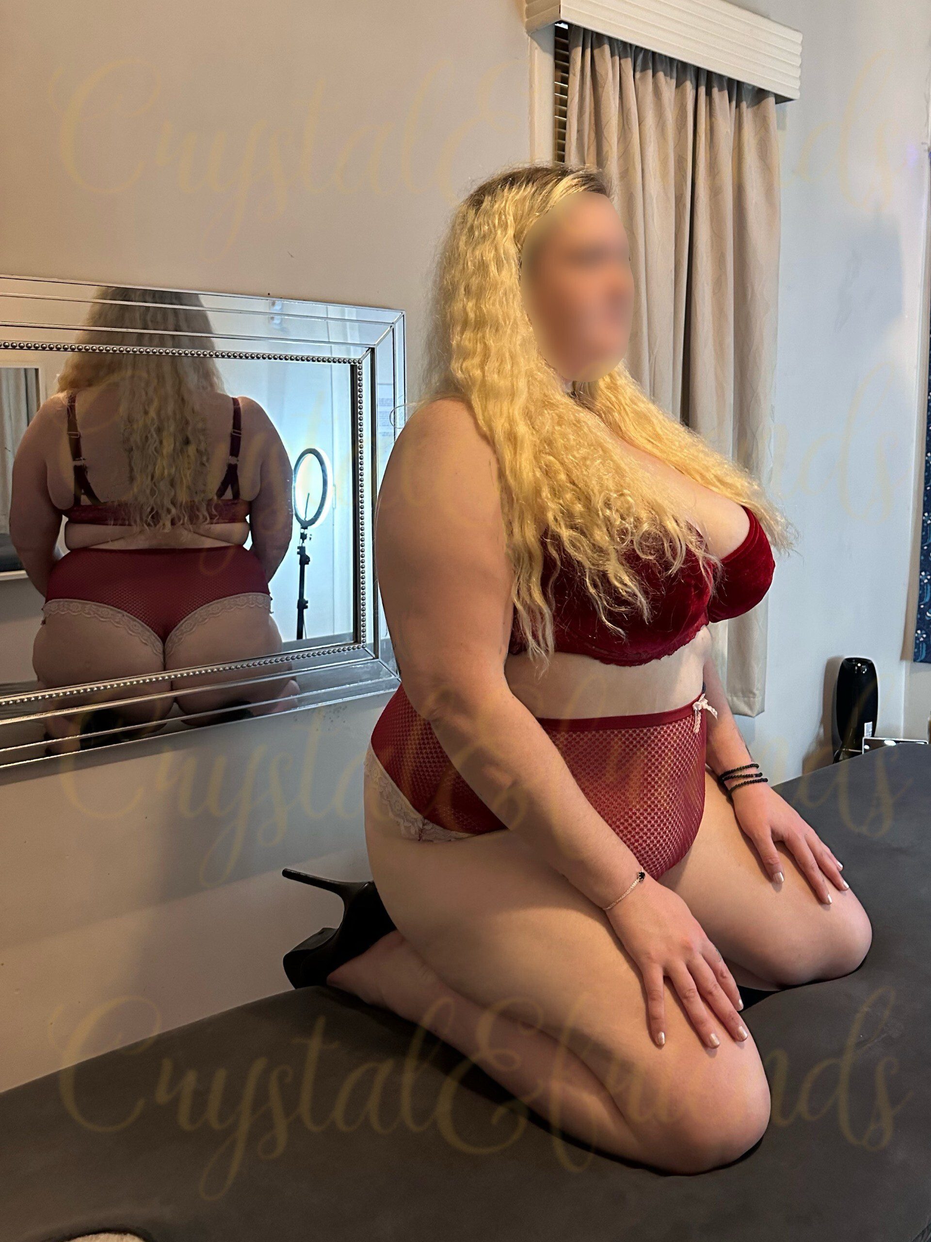 BBW with huge boobs posing in red lingerie